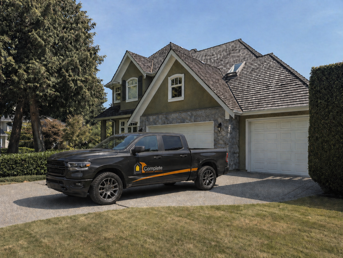 A Complete Exterior Services team member next to a marked work truck